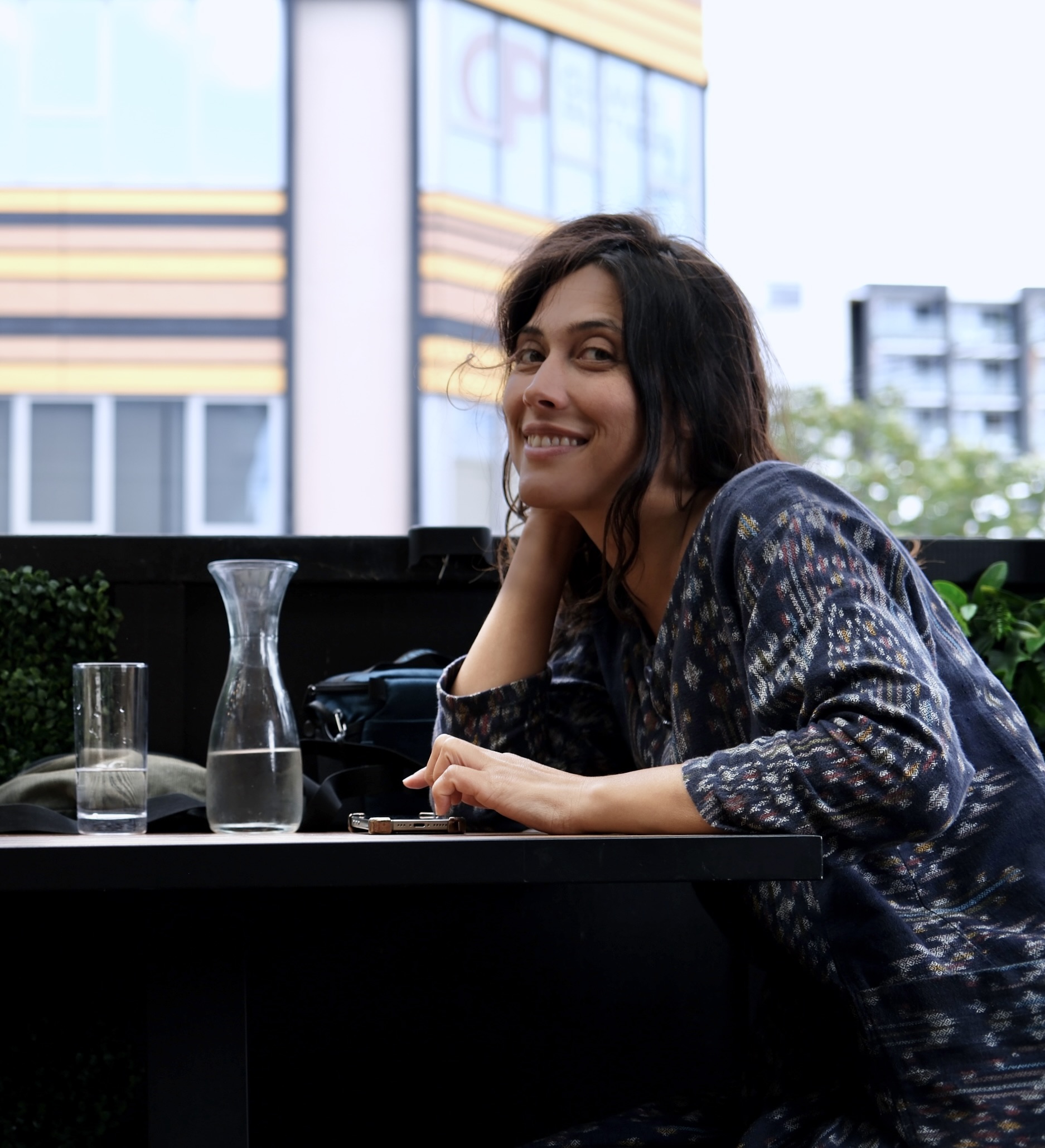 Aschel Gregory seated at a cafe table